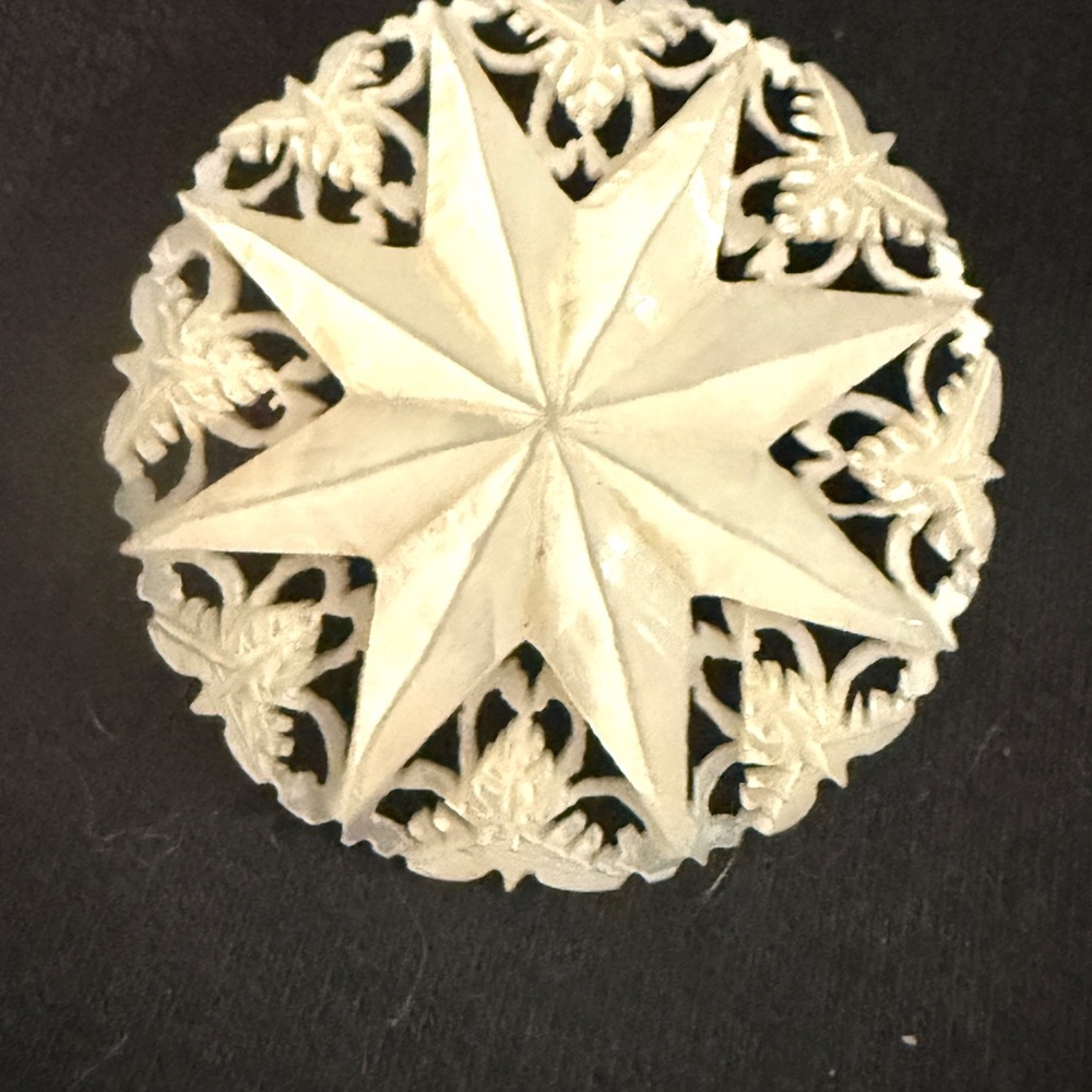 Elegant Silver Starburst Brooch